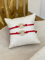 Pulsera hilo rojo y broche de circonia