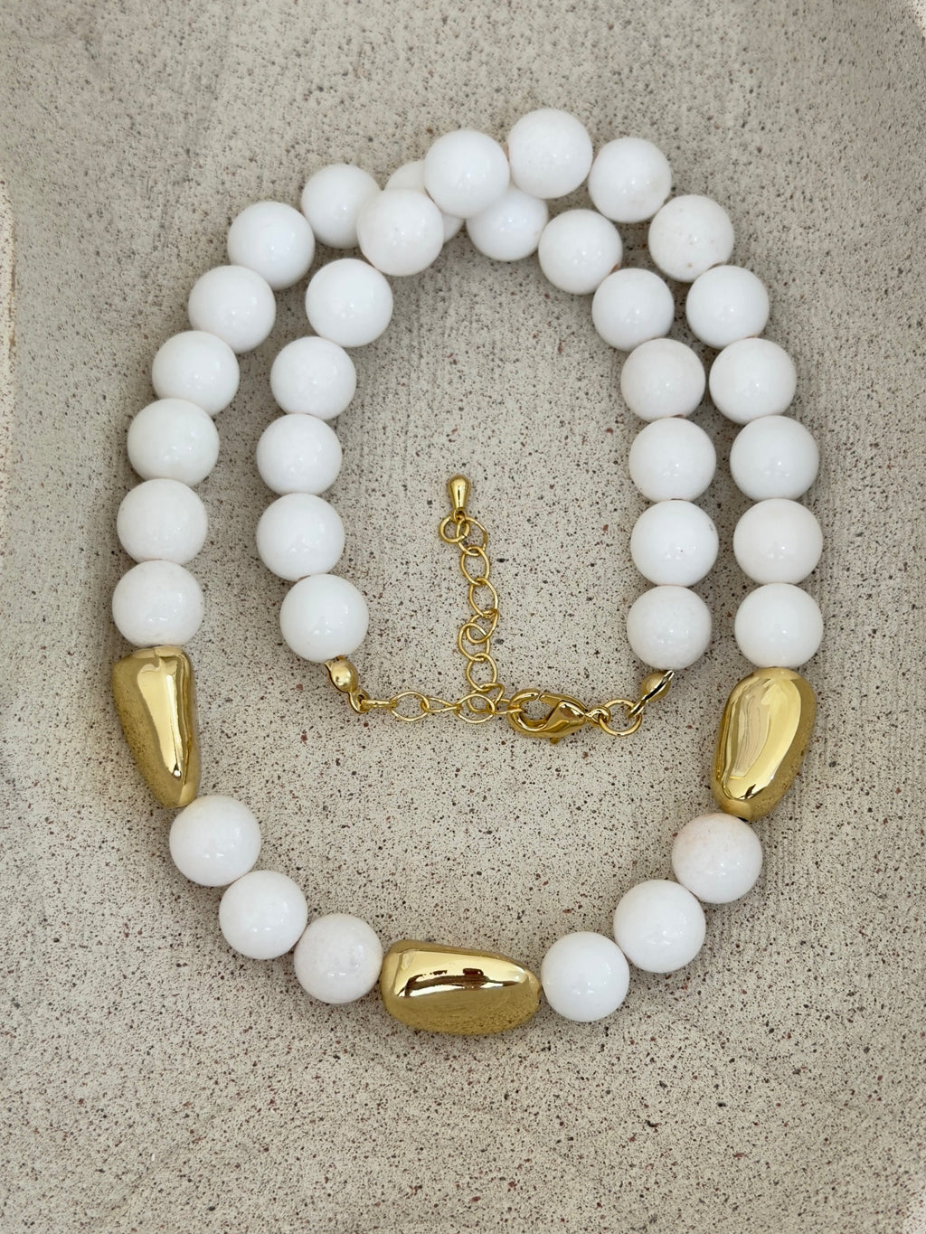 White and gold necklace